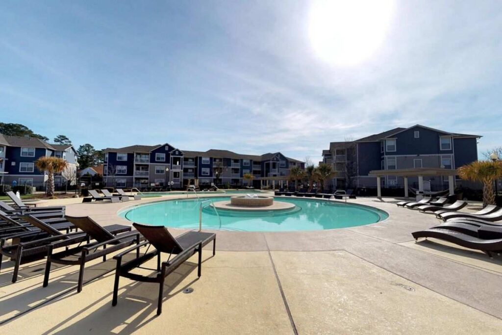 Resort-style swimming pool at The Landing Student Living housing, Greenville, NC