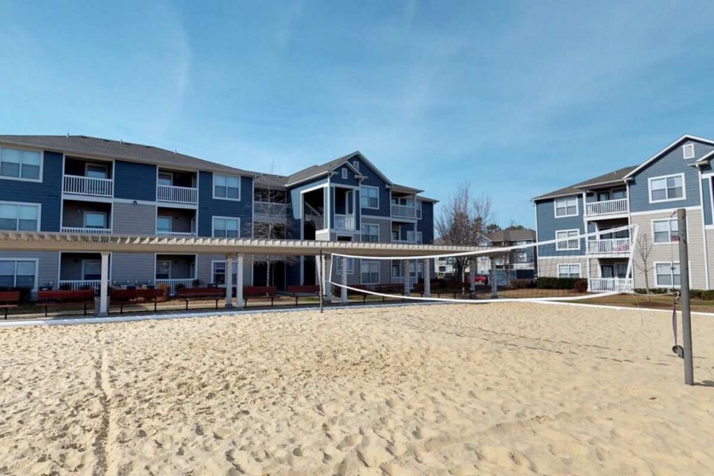 Sand volleyball court at The Landing Student Living housing in Greenville, NC